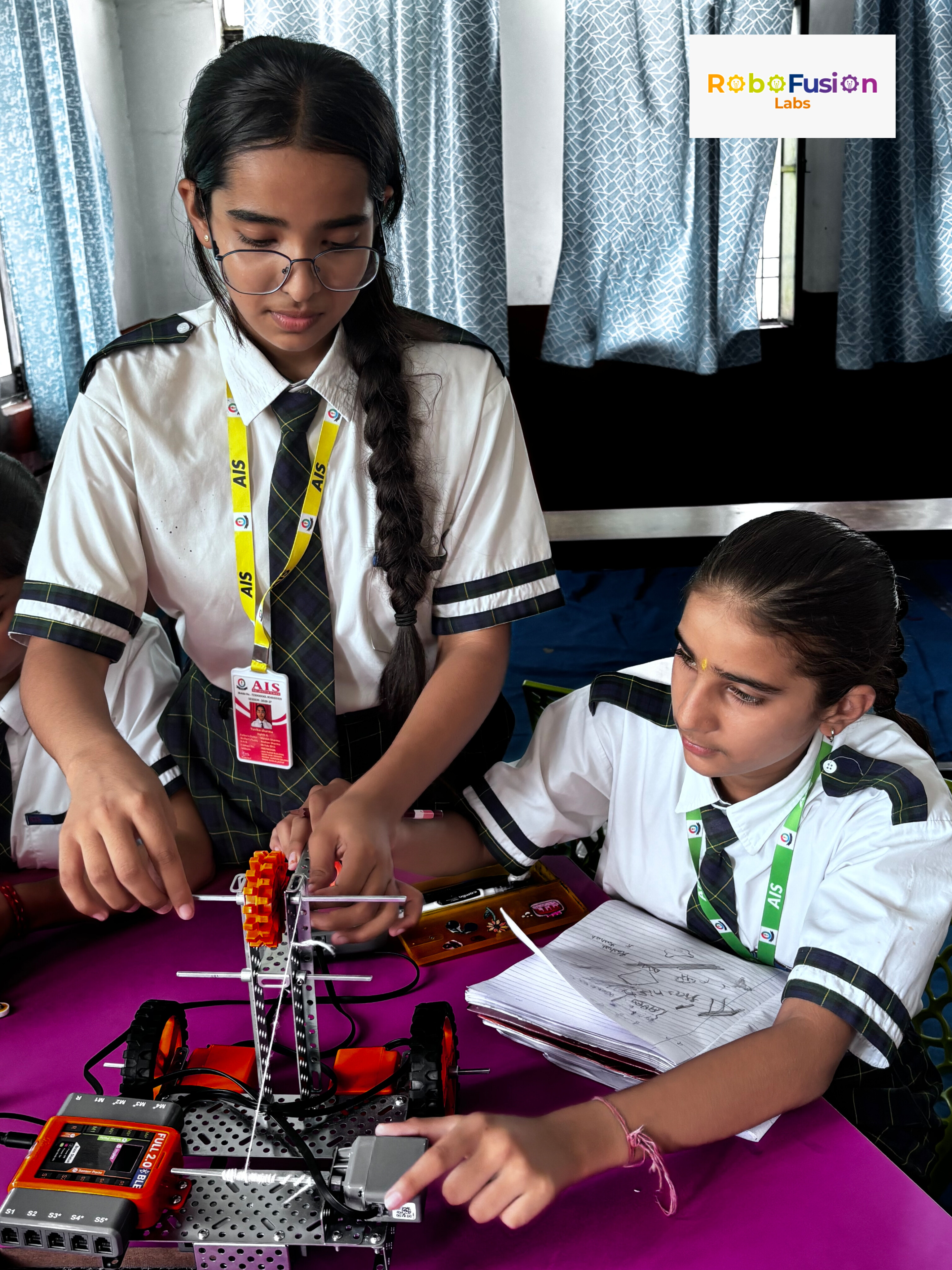 Students assembling robotics